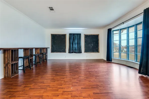 a view of livingroom with furniture window and wooden floor