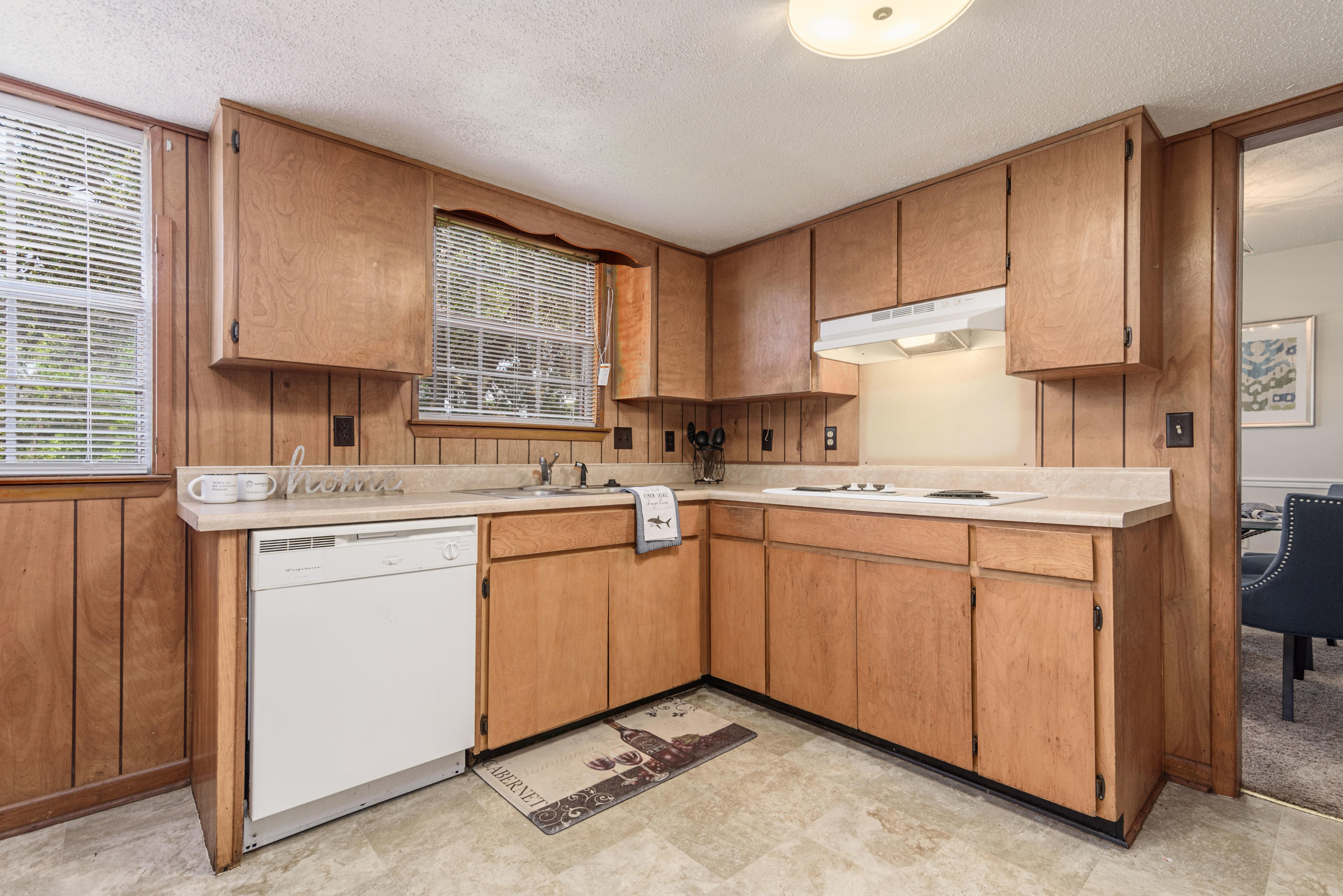 187 Country Club Road Shalimar, FL 32579 - Photo 16 of 68 a kitchen with granite countertop cabinets stainless steel appliances a sink and a window