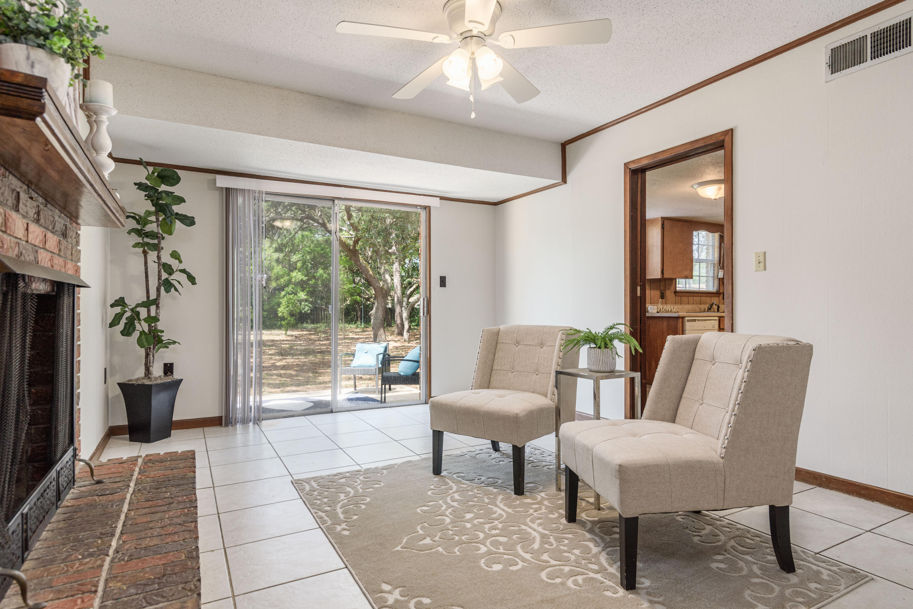 187 Country Club Road Shalimar, FL 32579 - Photo 21 of 68 a living room with furniture and a large window