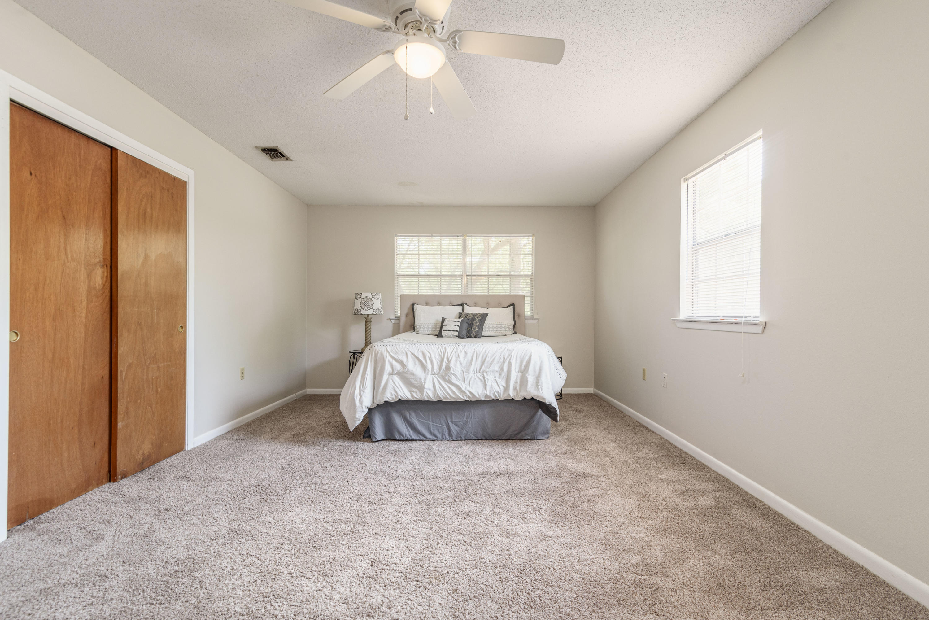 187 Country Club Road Shalimar, FL 32579 - Photo 29 of 68 a bedroom with a bed and a window