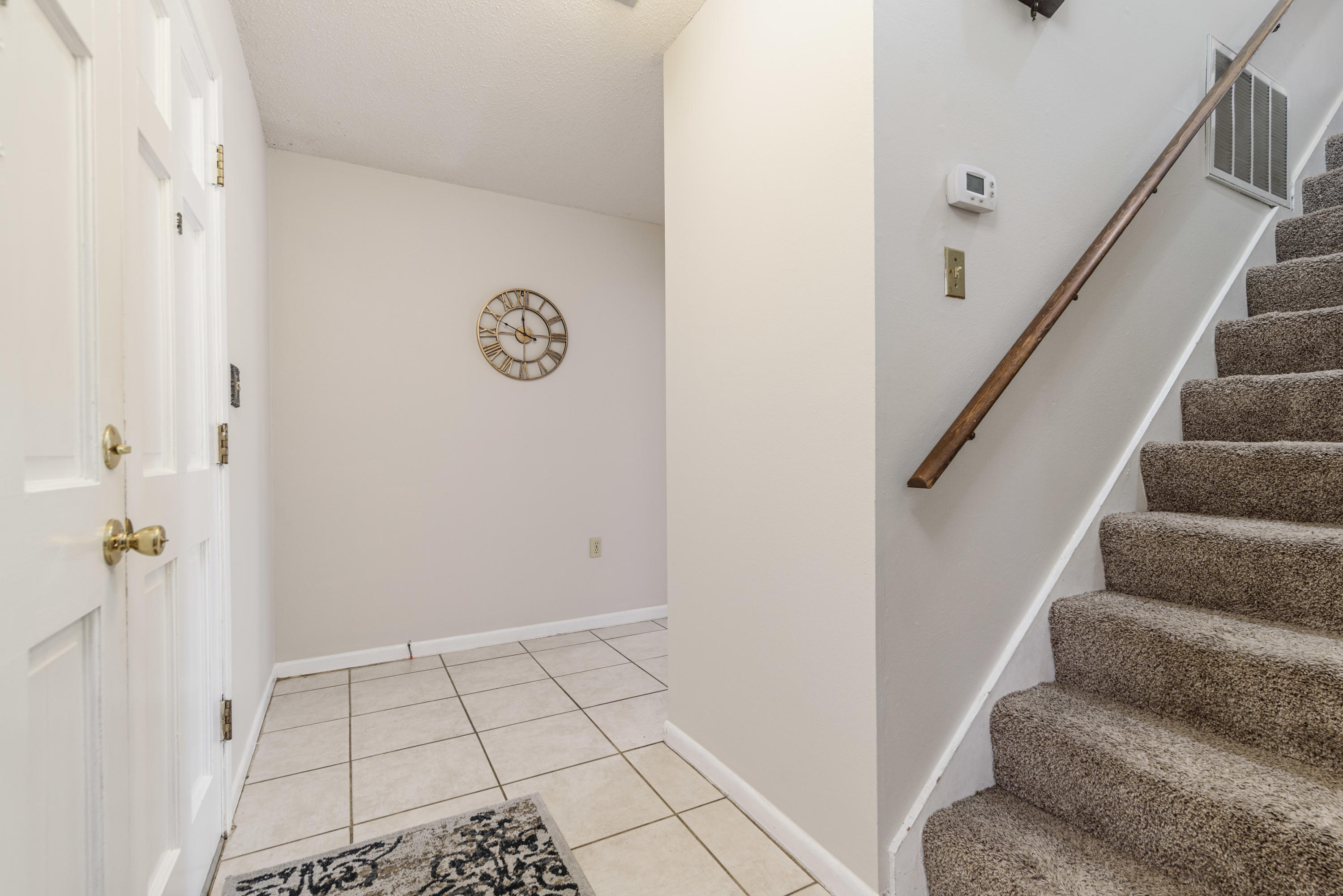 187 Country Club Road Shalimar, FL 32579 - Photo 4 of 68 a view of an entryway with staircase