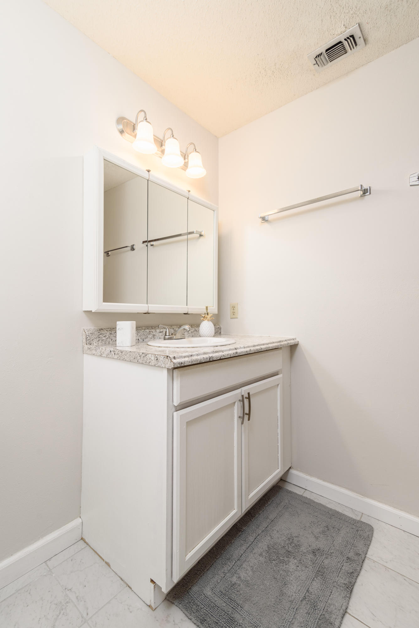 187 Country Club Road Shalimar, FL 32579 - Photo 35 of 68 a bathroom with a granite countertop sink and a mirror