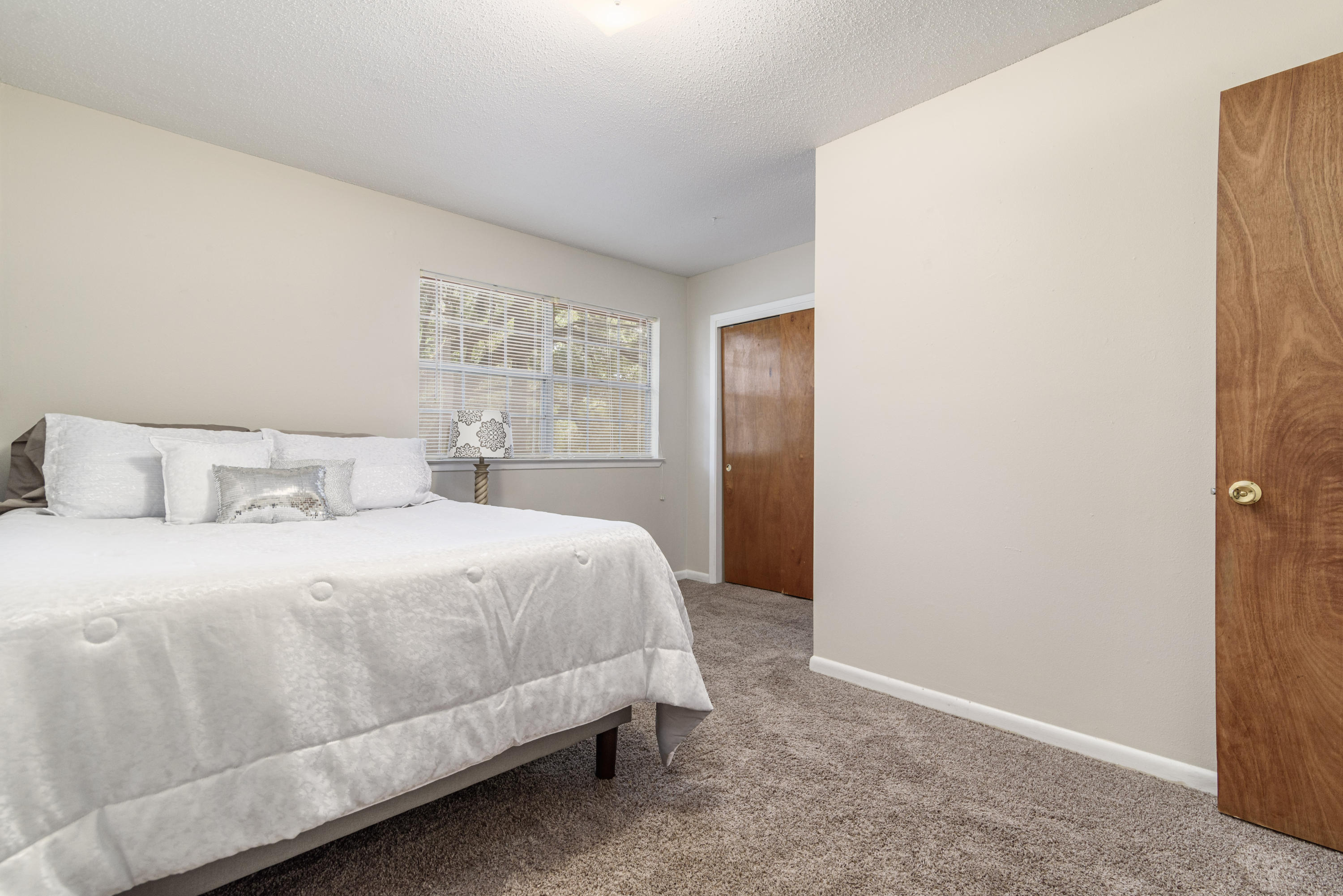 187 Country Club Road Shalimar, FL 32579 - Photo 38 of 68 a bedroom with a bed and a window