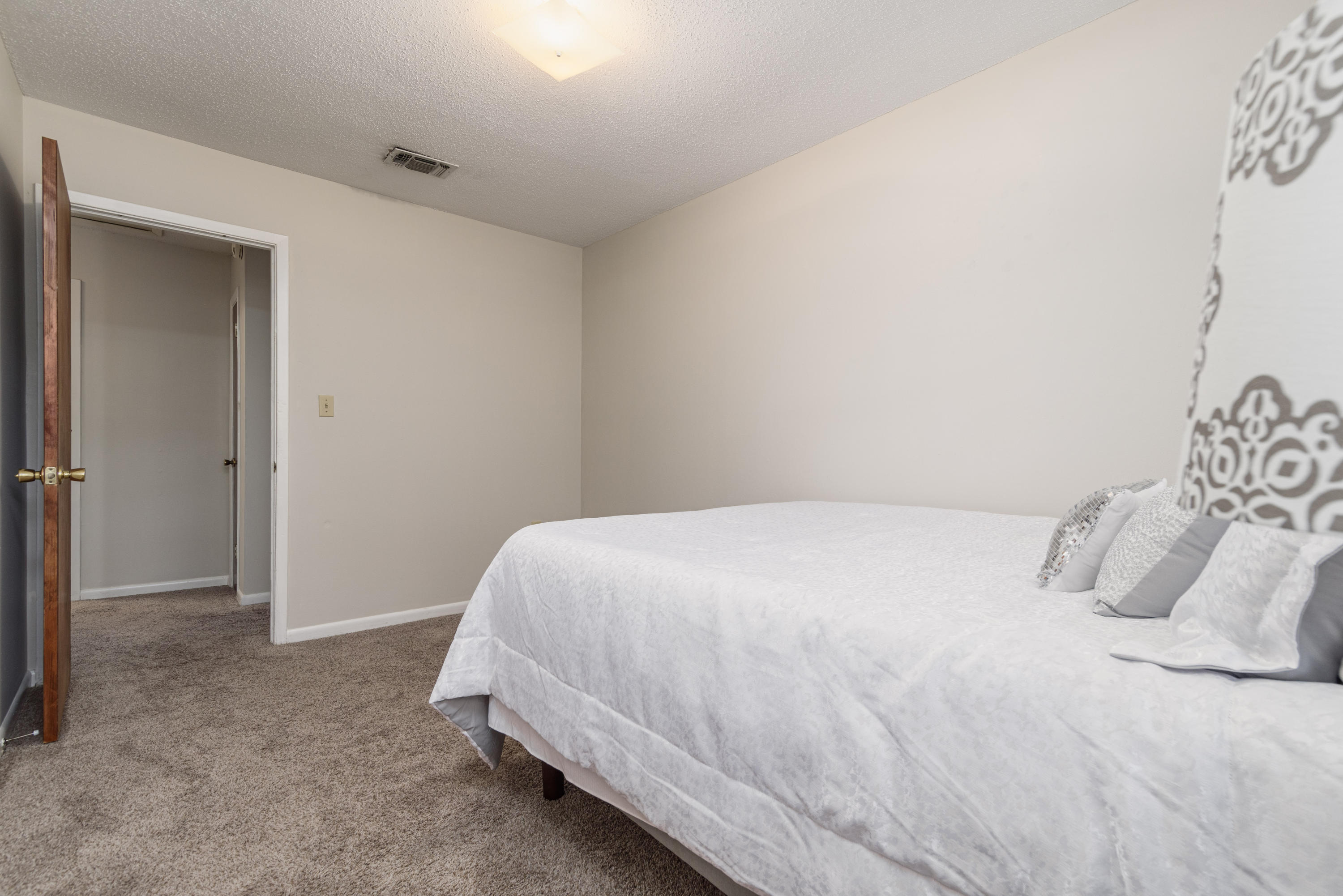 187 Country Club Road Shalimar, FL 32579 - Photo 41 of 68 a bedroom with a bed and a window