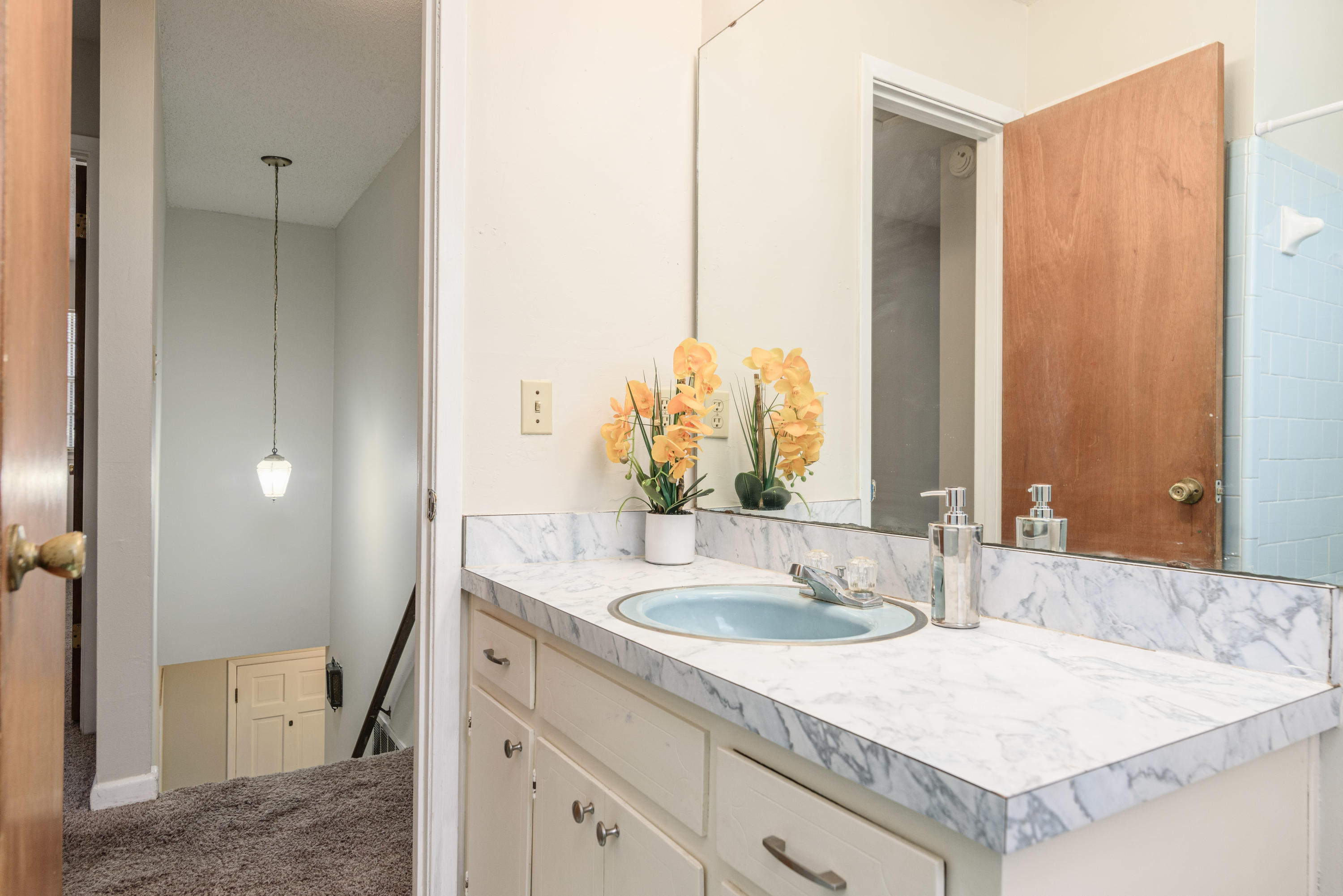 187 Country Club Road Shalimar, FL 32579 - Photo 42 of 68 a bathroom with a sink and a mirror
