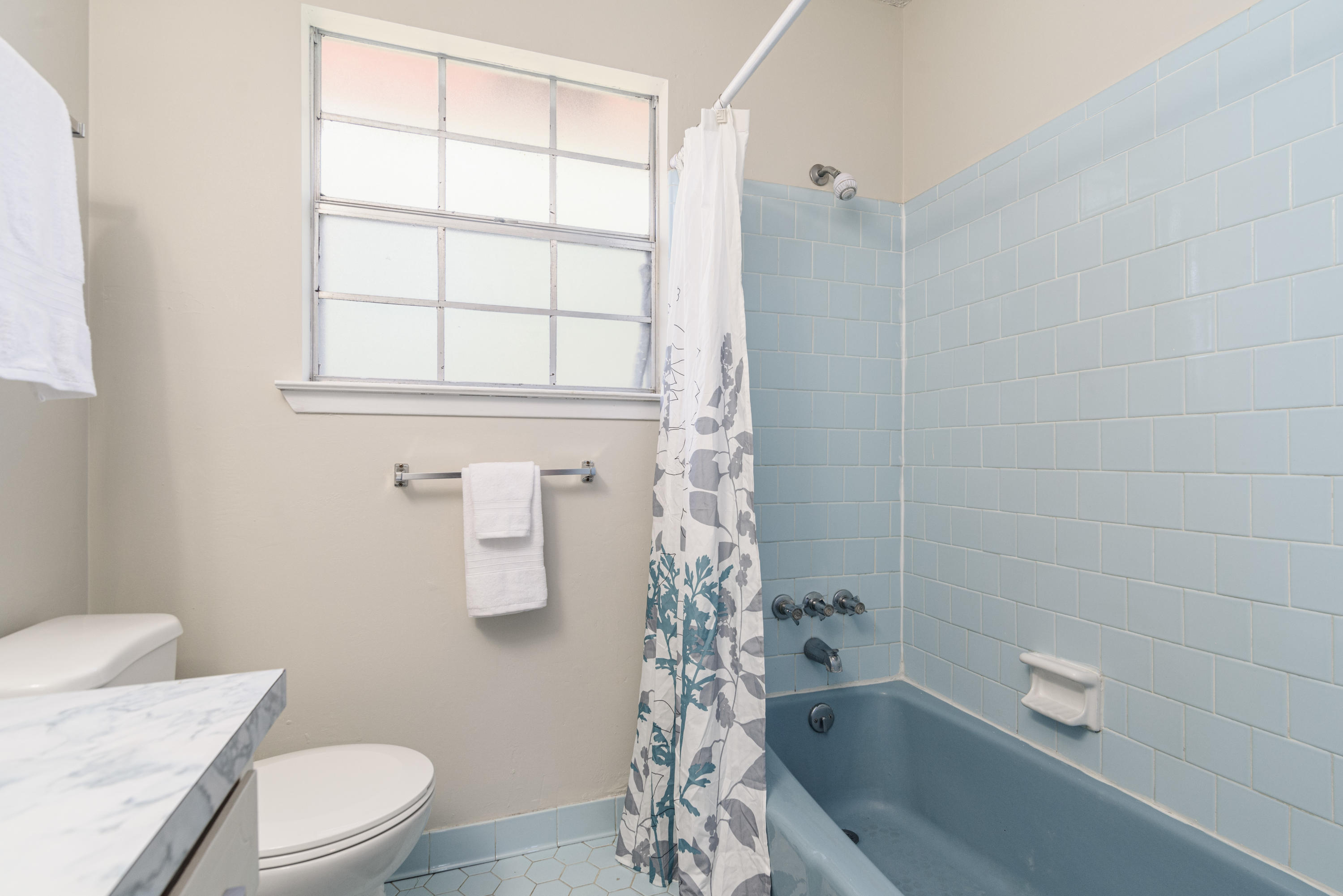 187 Country Club Road Shalimar, FL 32579 - Photo 45 of 68 a bathroom with a sink a toilet and shower