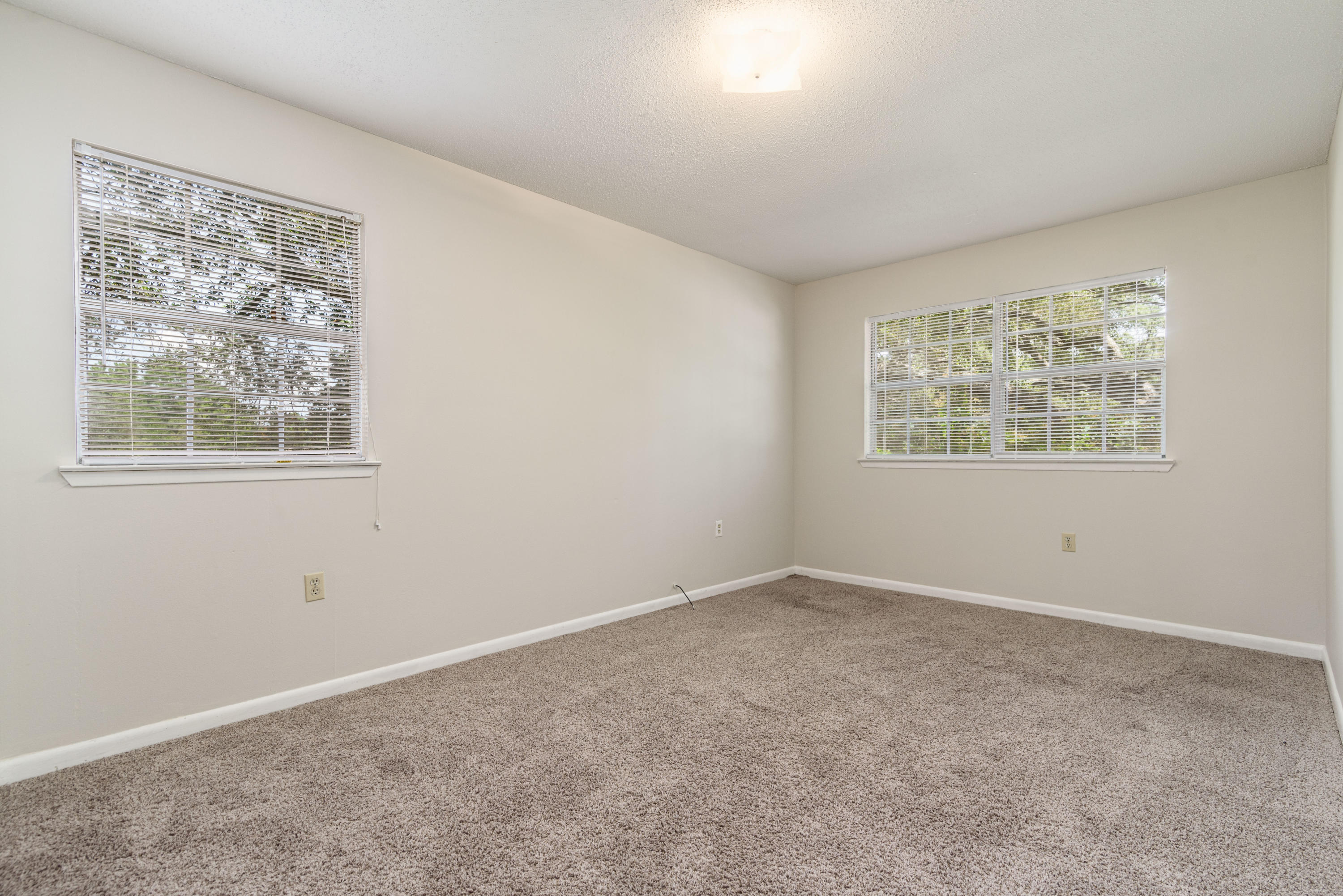 187 Country Club Road Shalimar, FL 32579 - Photo 48 of 68 a view of an empty room with a window