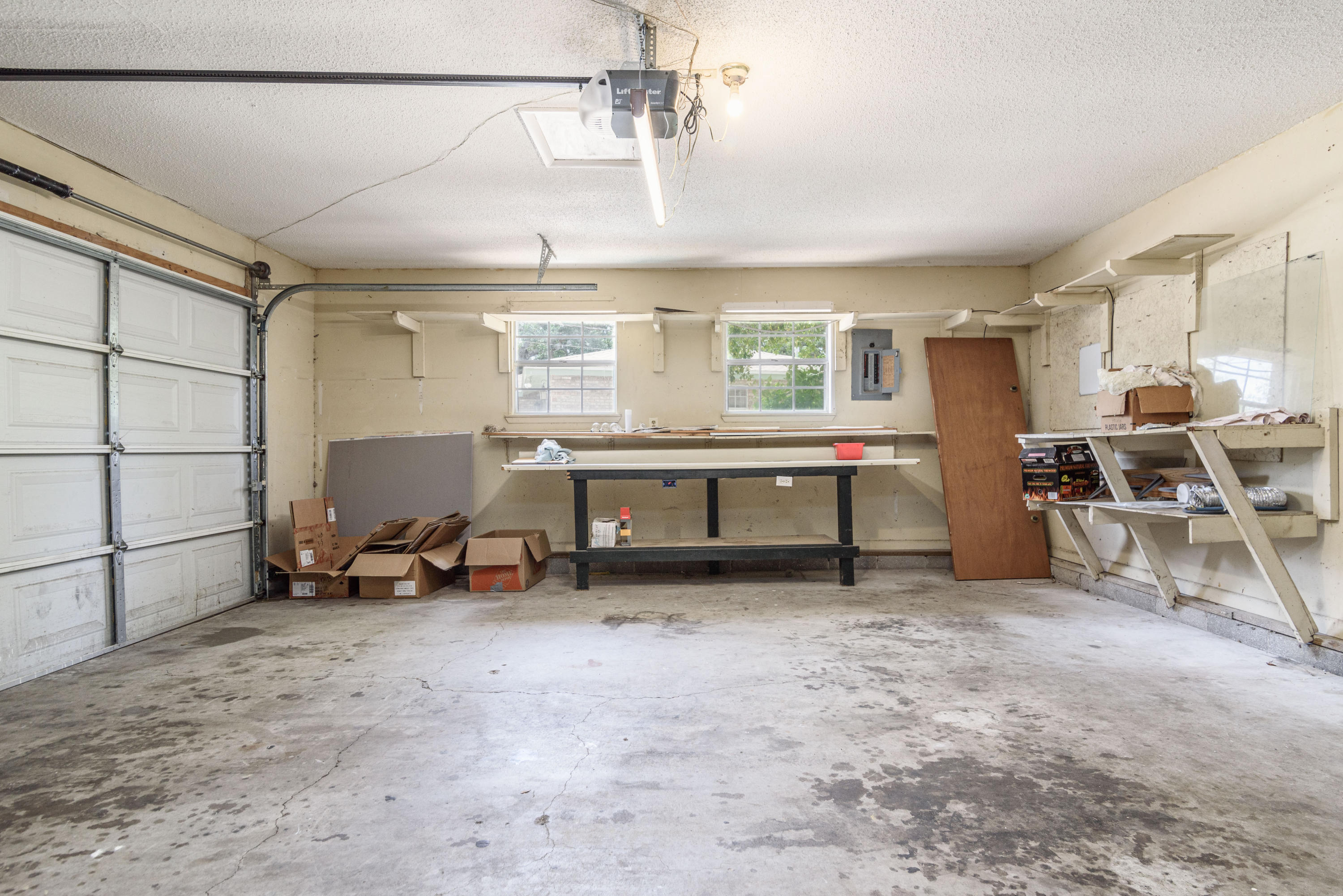 187 Country Club Road Shalimar, FL 32579 - Photo 50 of 68 a view of a workspace with furniture and a window