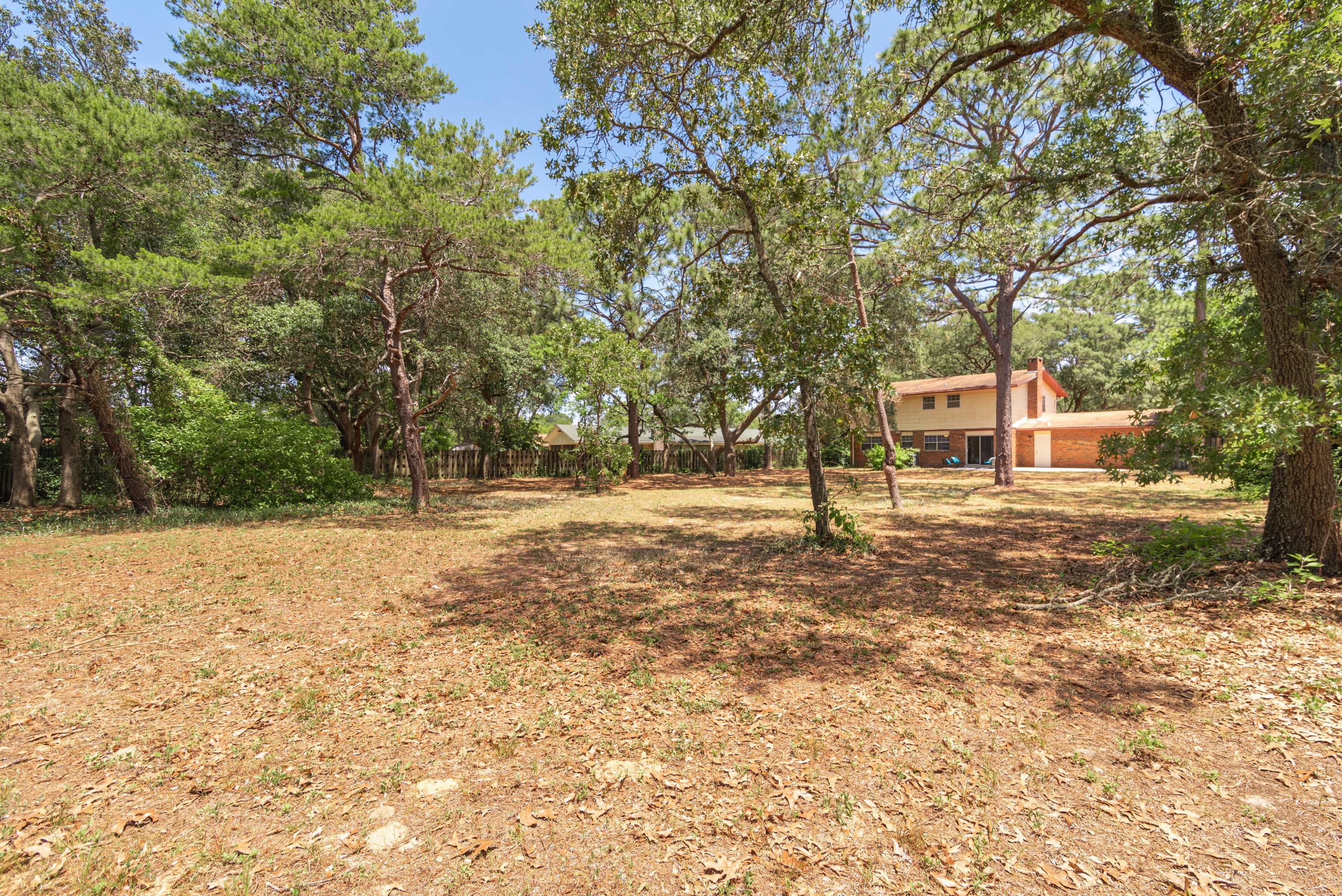 187 Country Club Road Shalimar, FL 32579 - Photo 52 of 68 a view of yard with trees