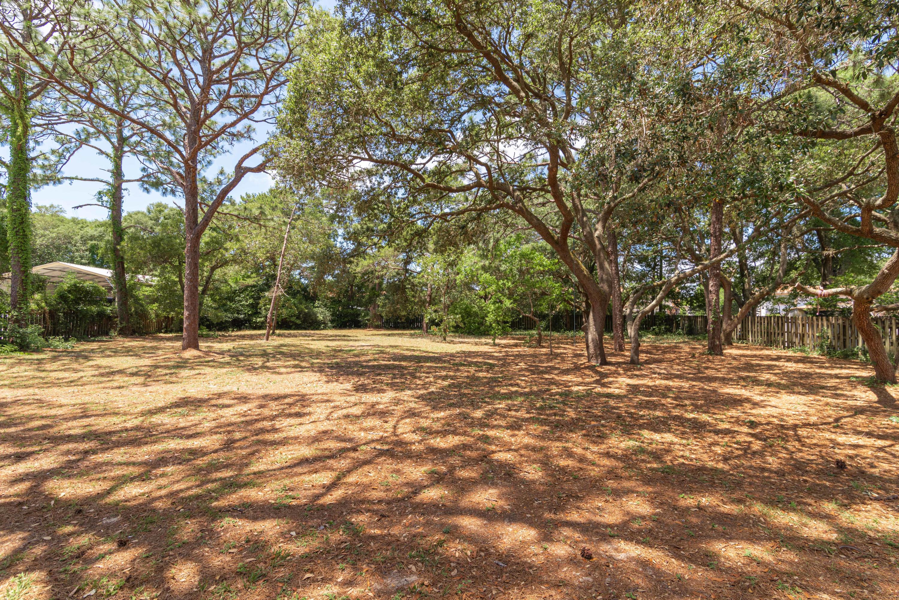 187 Country Club Road Shalimar, FL 32579 - Photo 64 of 68 a view of a yard with a trees