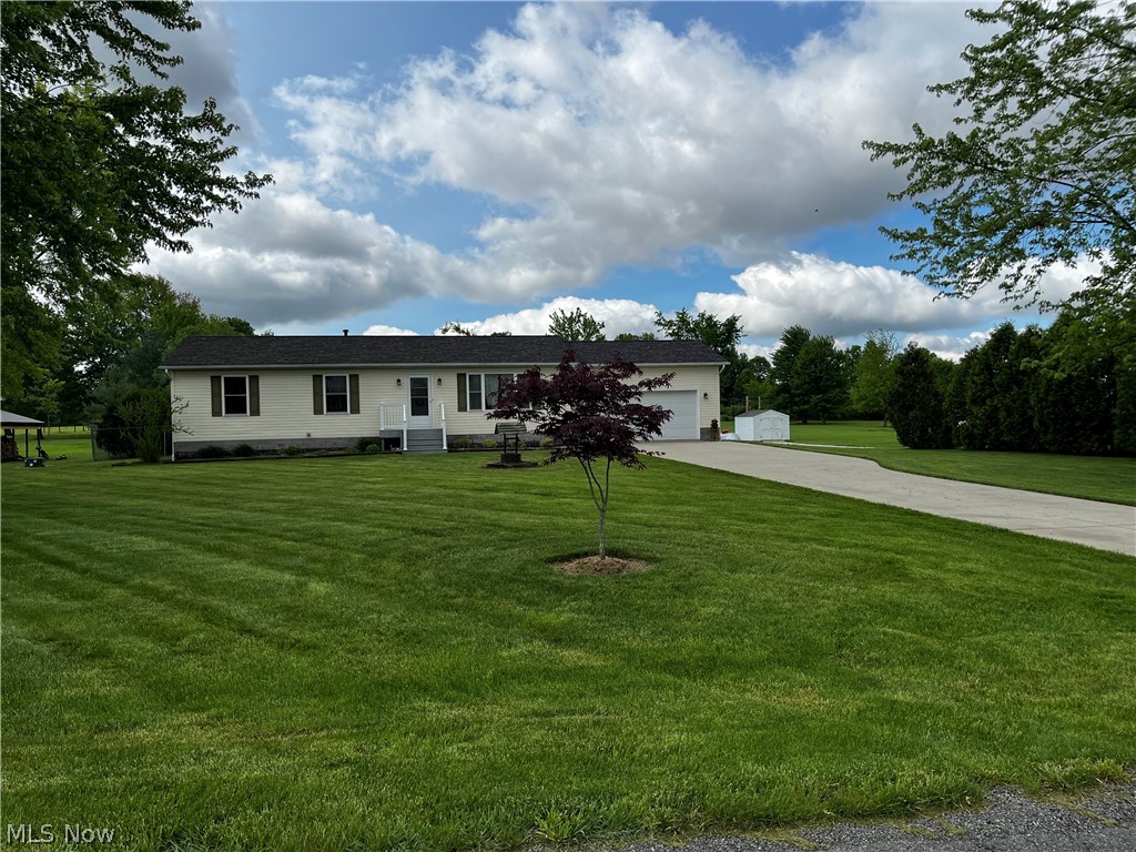 6876 Clark Road Atwater, OH 44201 - Photo 39 of 41 View of front facade with a garage and a front lawn
