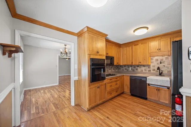 a kitchen with stainless steel appliances granite countertop a stove and a refrigerator