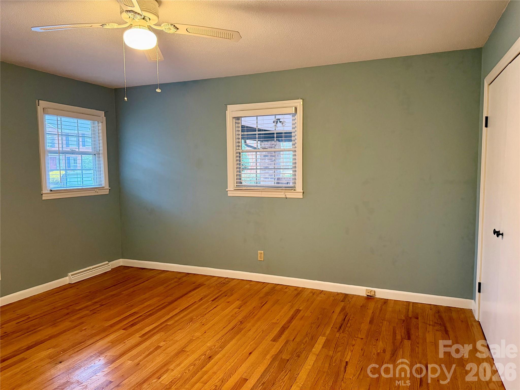 1412 Ebinport Road Rock Hill, SC 29732 - Photo 20 of 35 a view of an empty room with wooden floor and a window