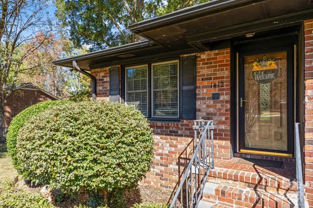a view of house with outdoor seating