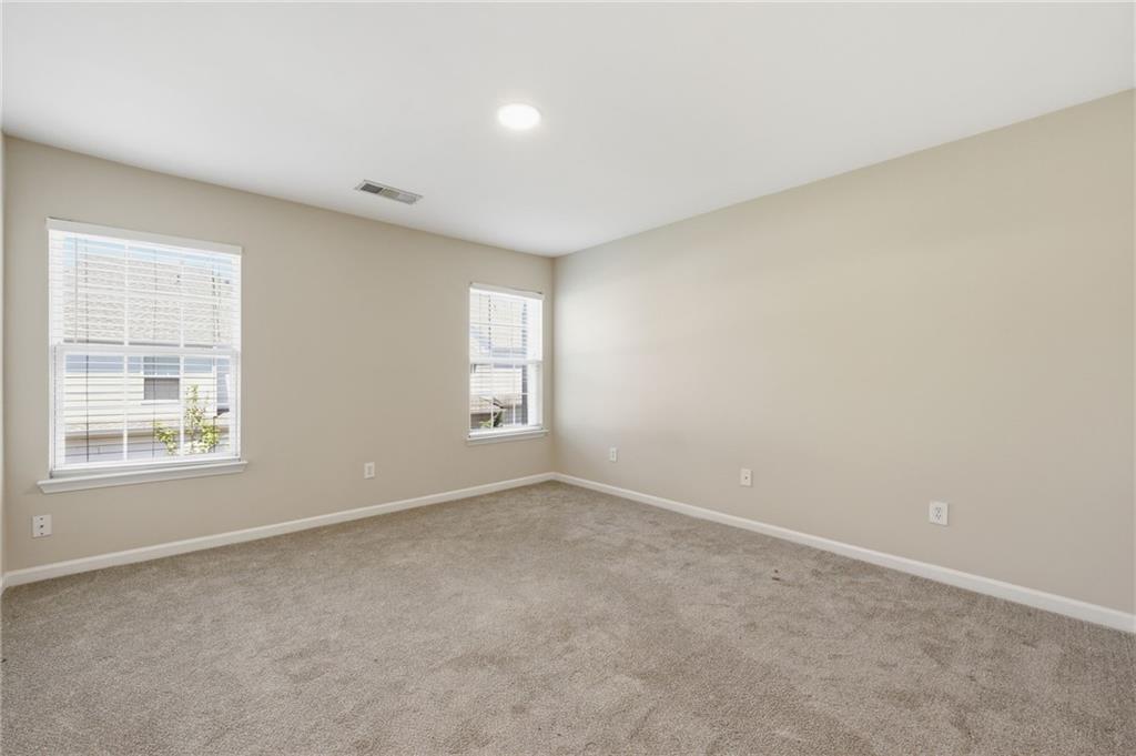 2335 Meadow Peak Point Duluth, GA 30097 - Photo 16 of 32 an empty room with windows