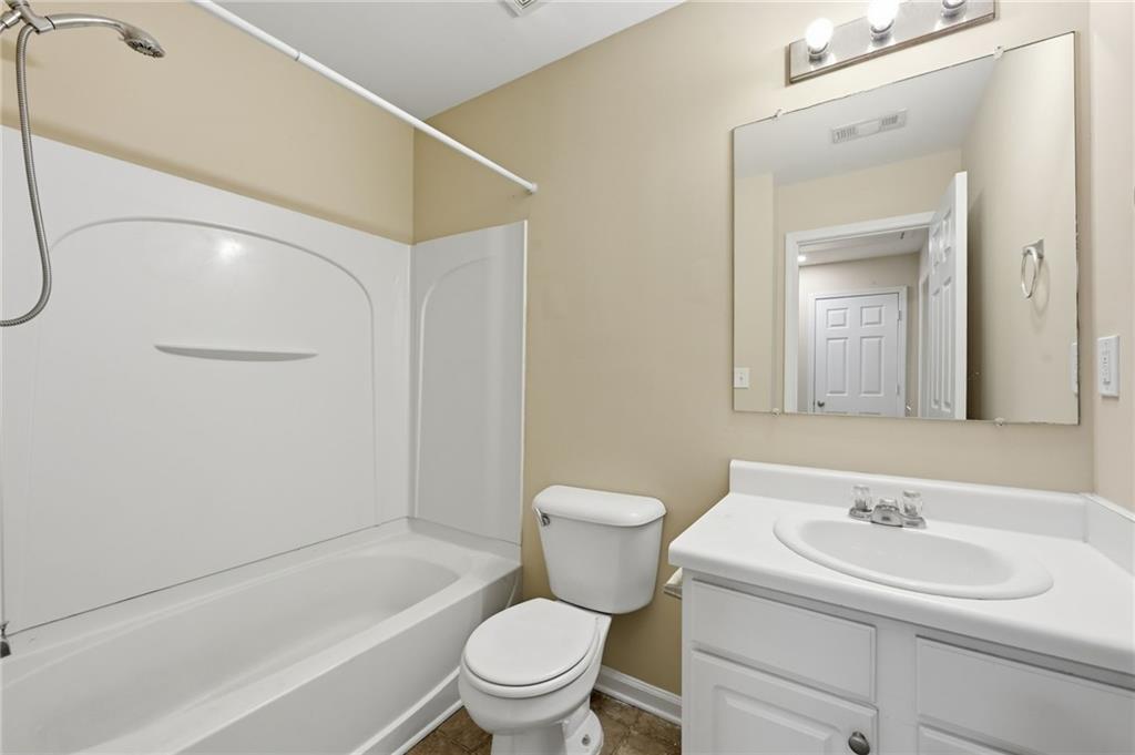 2335 Meadow Peak Point Duluth, GA 30097 - Photo 25 of 32 a bathroom with a sink toilet and shower