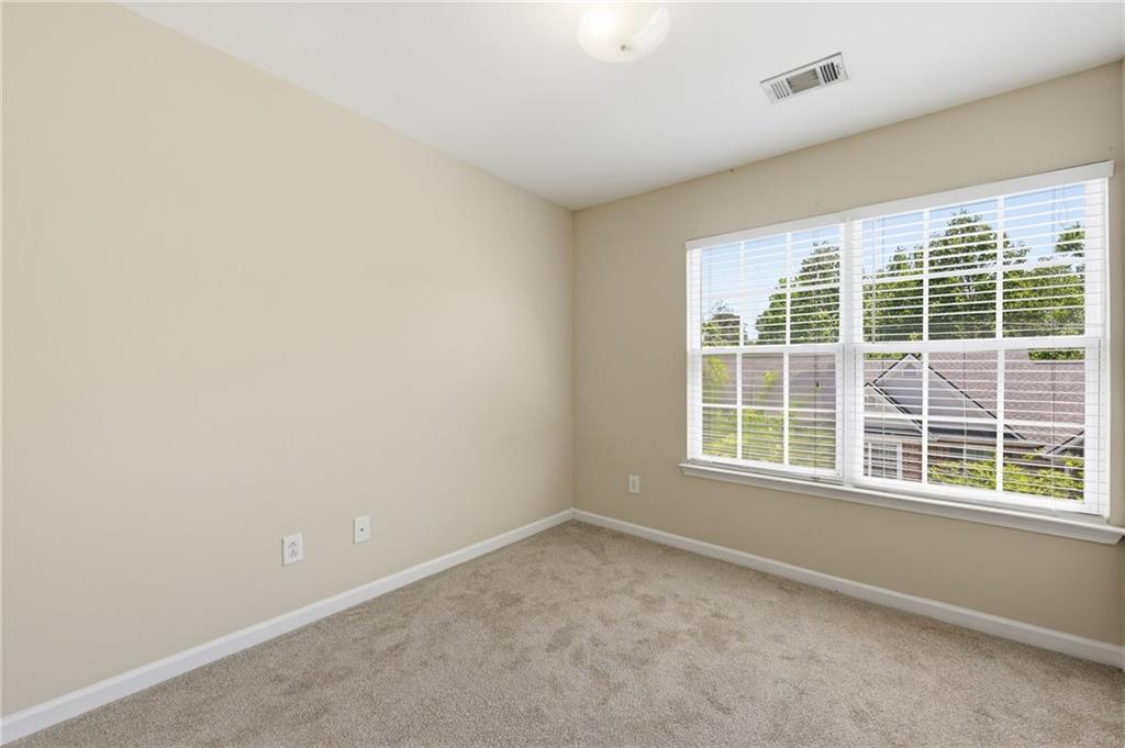2335 Meadow Peak Point Duluth, GA 30097 - Photo 26 of 32 an empty room with a window