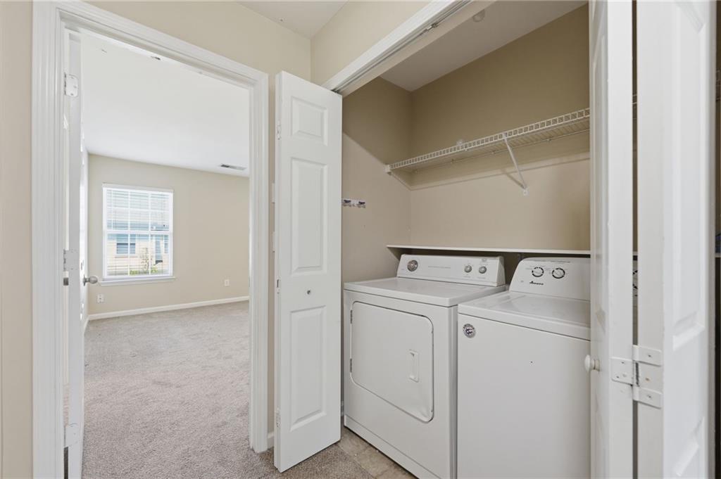 2335 Meadow Peak Point Duluth, GA 30097 - Photo 28 of 32 a utility room with dryer and washer