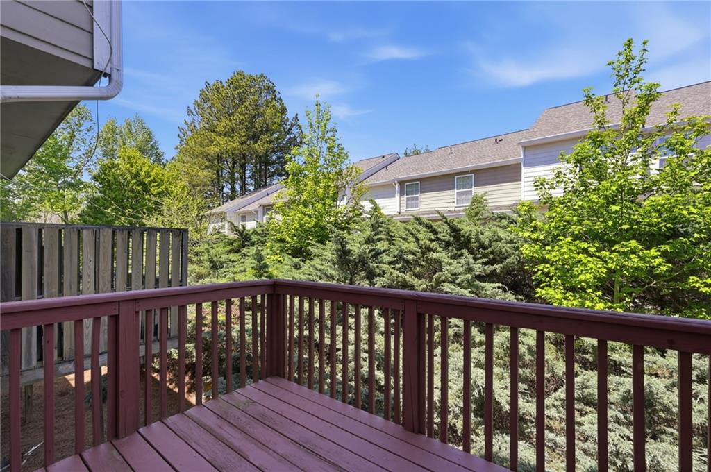 2335 Meadow Peak Point Duluth, GA 30097 - Photo 29 of 32 a balcony with wooden floor and outdoor space