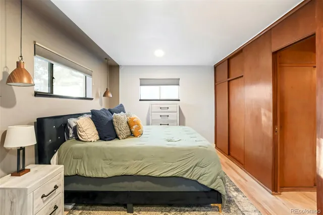 a bedroom with a large bed and a window