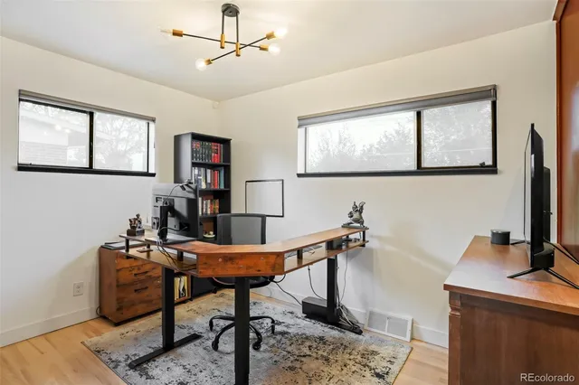 a view of a workspace with furniture