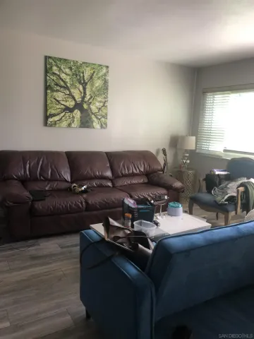 a living room with furniture and window