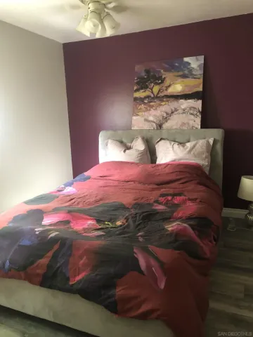 a bedroom with a bed and a fireplace