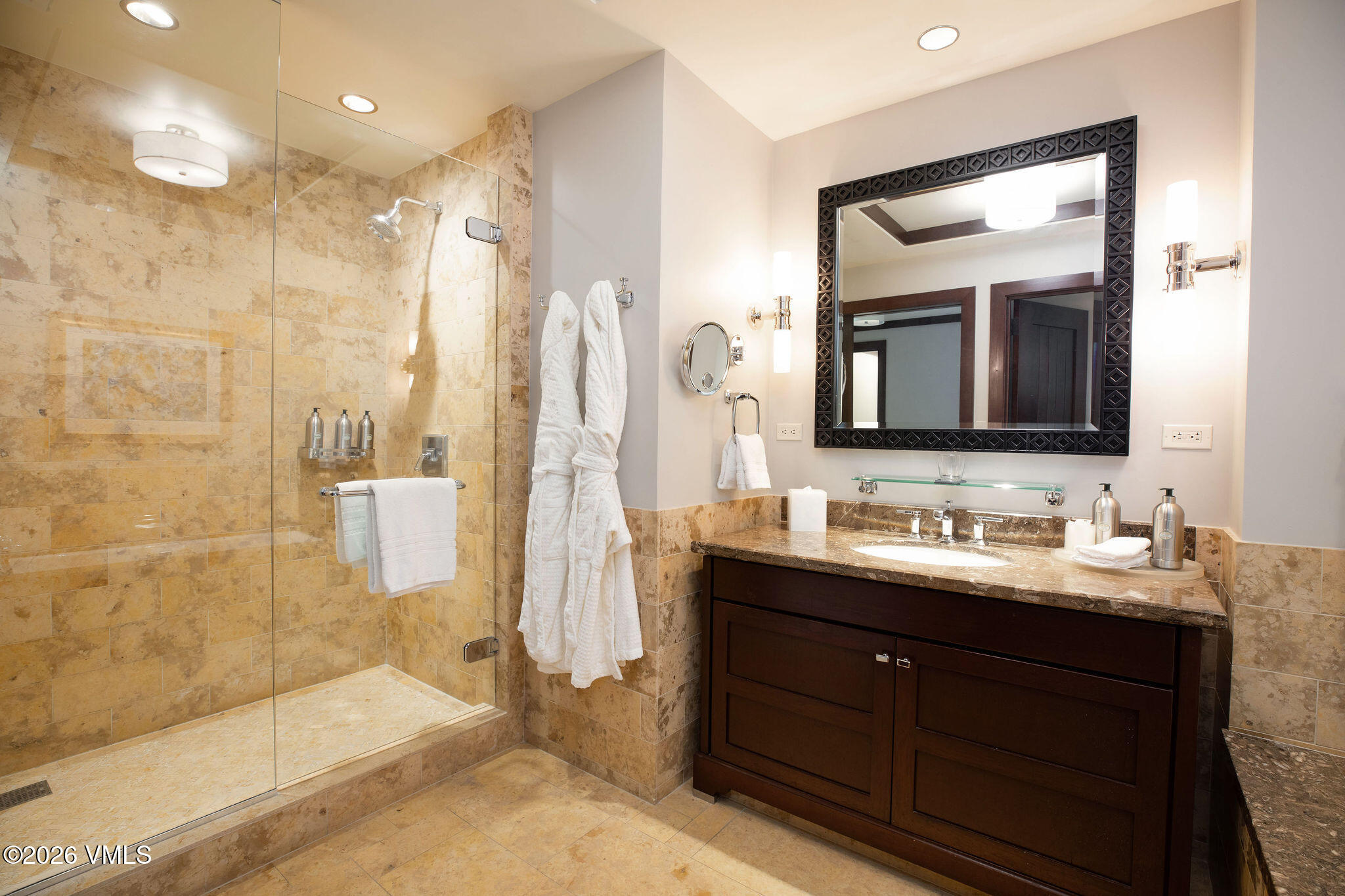 1 Vail Road, Unit 5102J Vail, CO 81657 - Photo 10 of 26 a bathroom with a double vanity sink mirror and shower
