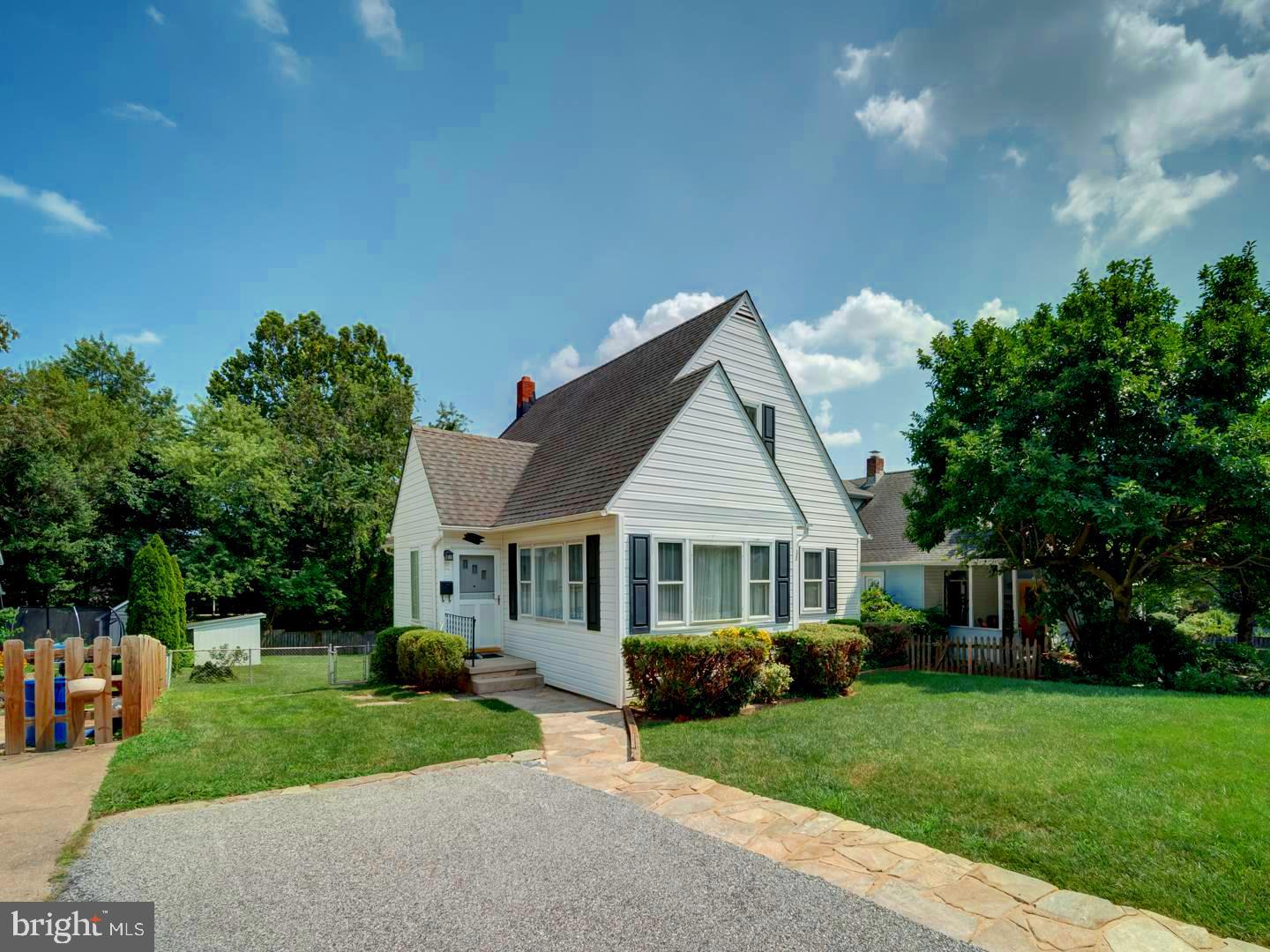 6505 Beechwood Road Baltimore, MD 21239 - Photo 1 of 46 a front view of a house with a yard