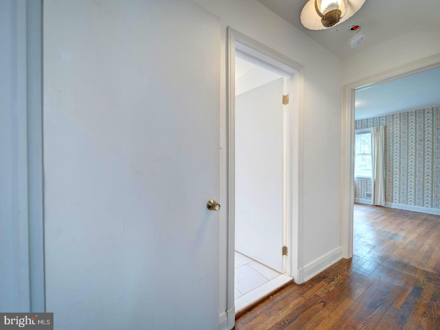 6505 Beechwood Road Baltimore, MD 21239 - Photo 18 of 46 a view of a hallway with wooden floor