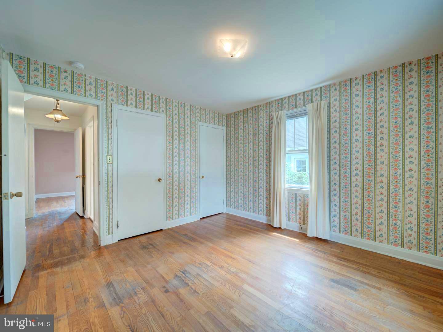 6505 Beechwood Road Baltimore, MD 21239 - Photo 21 of 46 wooden floor in an empty room
