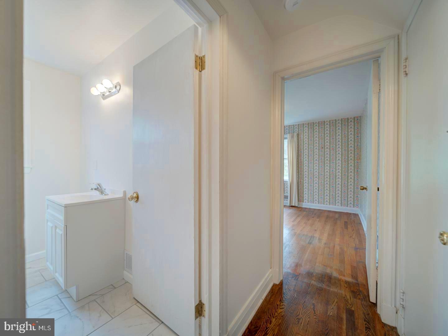 6505 Beechwood Road Baltimore, MD 21239 - Photo 24 of 46 a view of a hallway with wooden floor