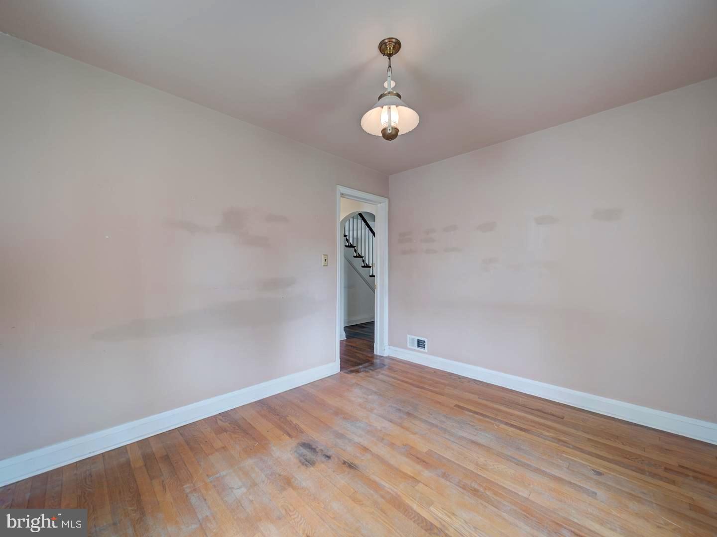 6505 Beechwood Road Baltimore, MD 21239 - Photo 27 of 46 wooden floor in an empty room