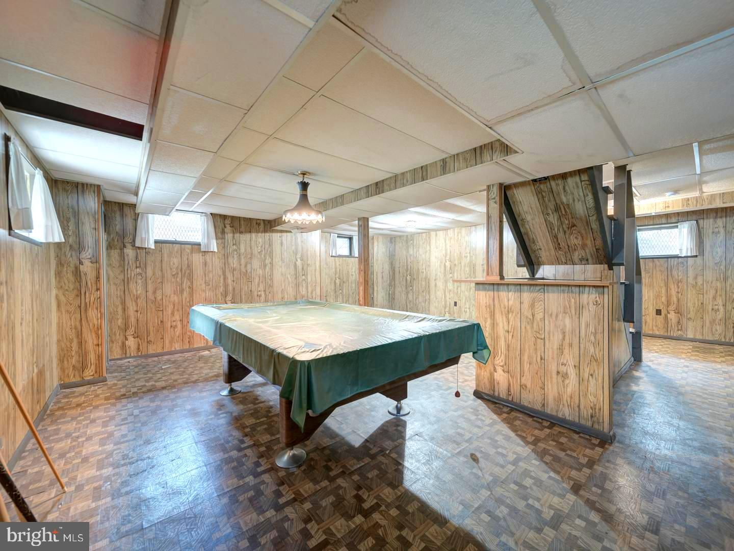 6505 Beechwood Road Baltimore, MD 21239 - Photo 30 of 46 a room with wooden floors and pool table