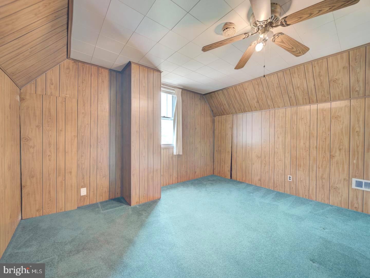 6505 Beechwood Road Baltimore, MD 21239 - Photo 34 of 46 an empty room with fan and windows