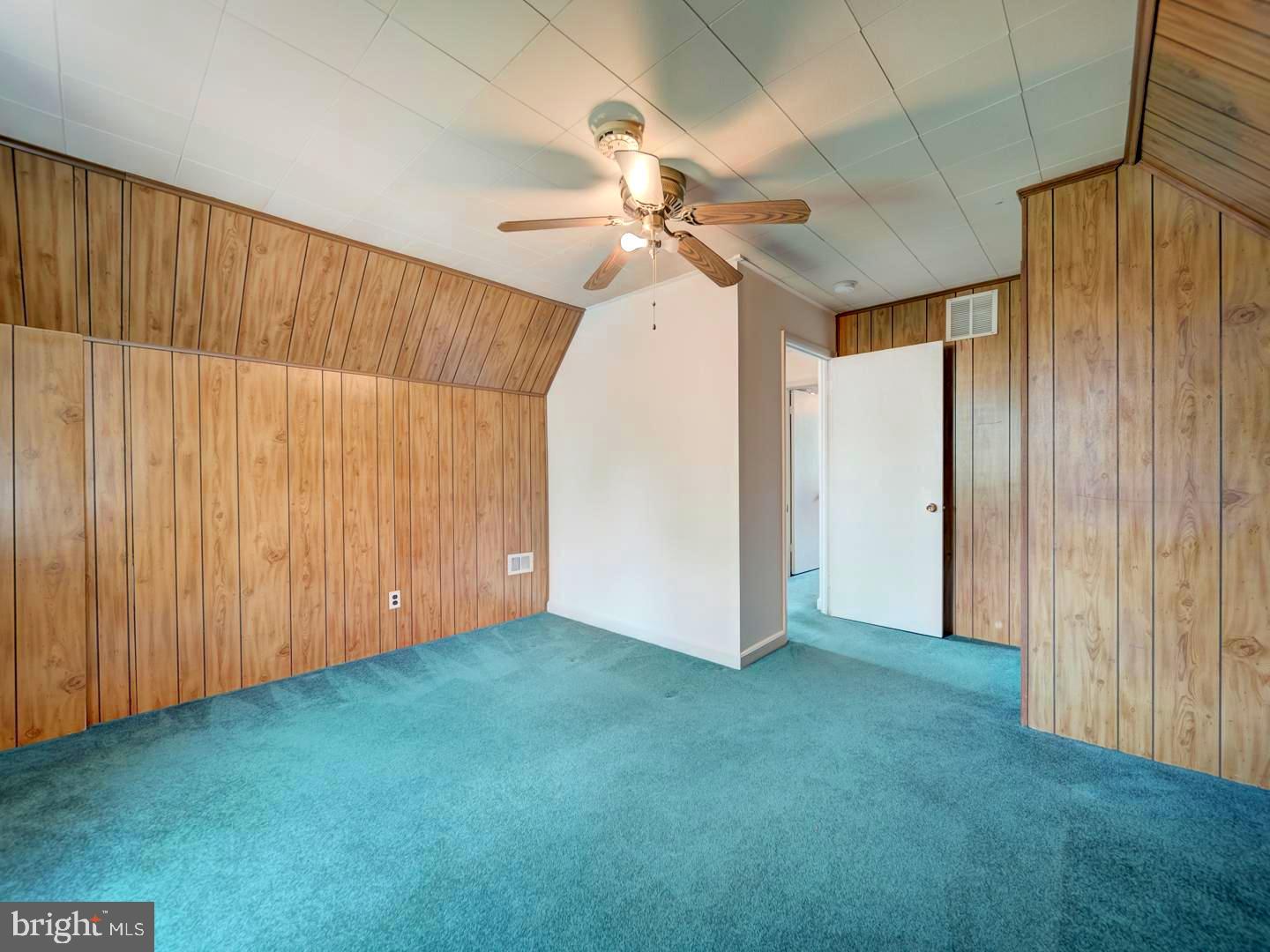 6505 Beechwood Road Baltimore, MD 21239 - Photo 35 of 46 wooden floor in an empty room with a window