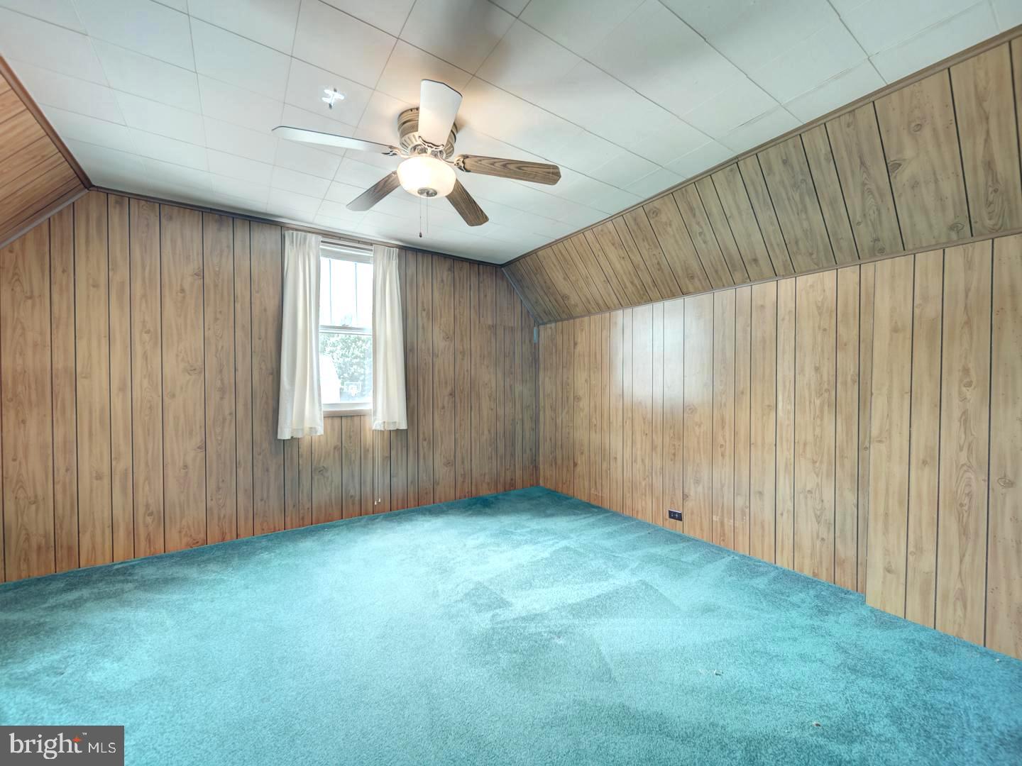 6505 Beechwood Road Baltimore, MD 21239 - Photo 39 of 46 an empty room with windows and fan