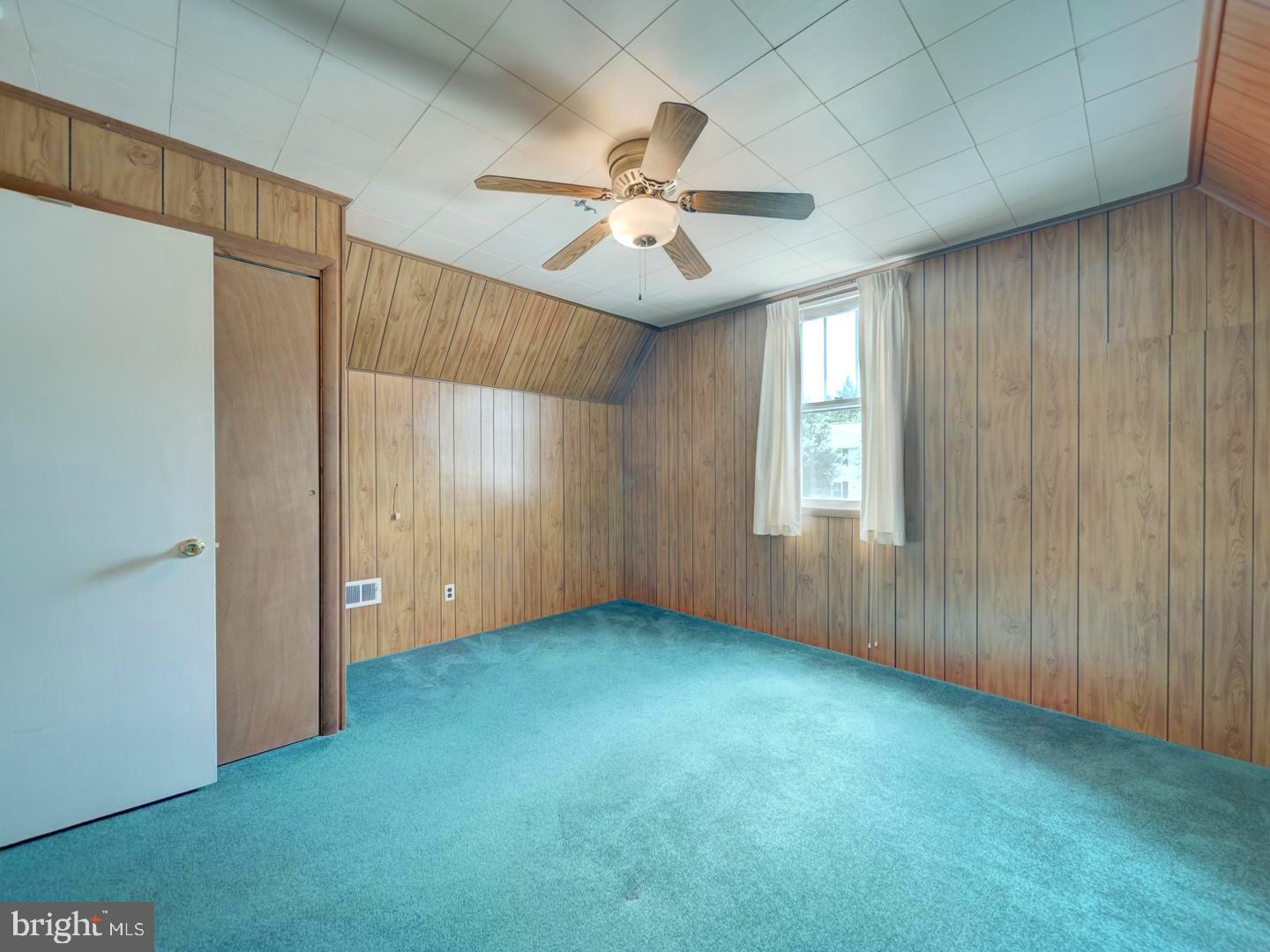 6505 Beechwood Road Baltimore, MD 21239 - Photo 40 of 46 an empty room with windows and fan