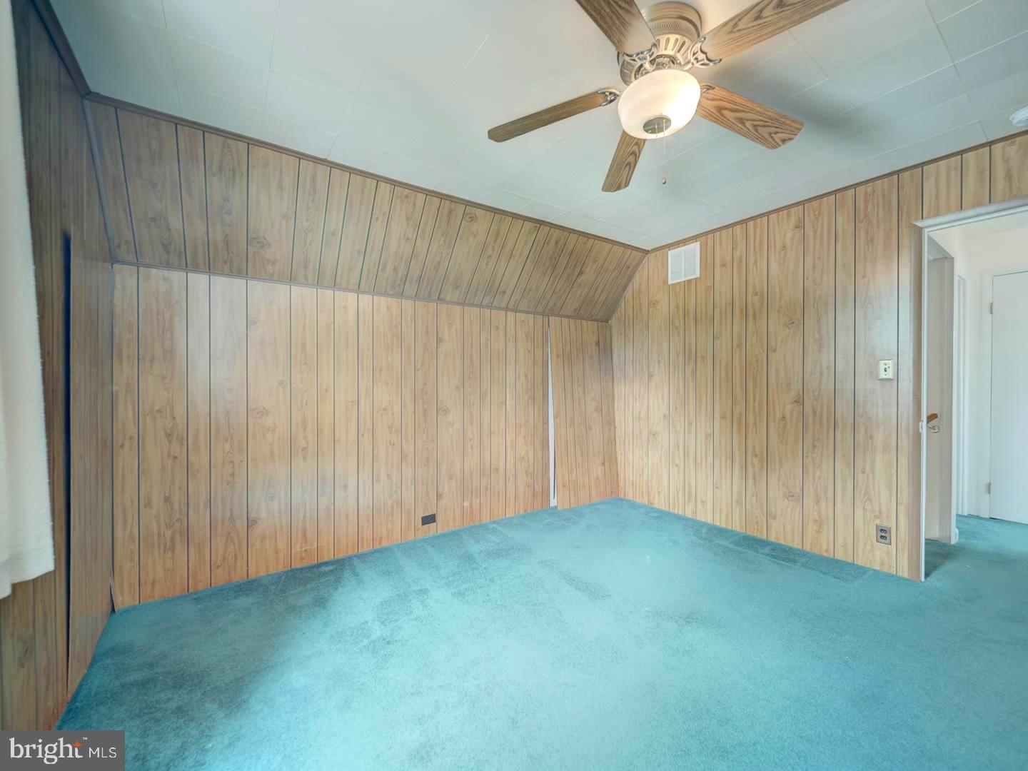 6505 Beechwood Road Baltimore, MD 21239 - Photo 42 of 46 an empty room with a fan & a ceiling fan