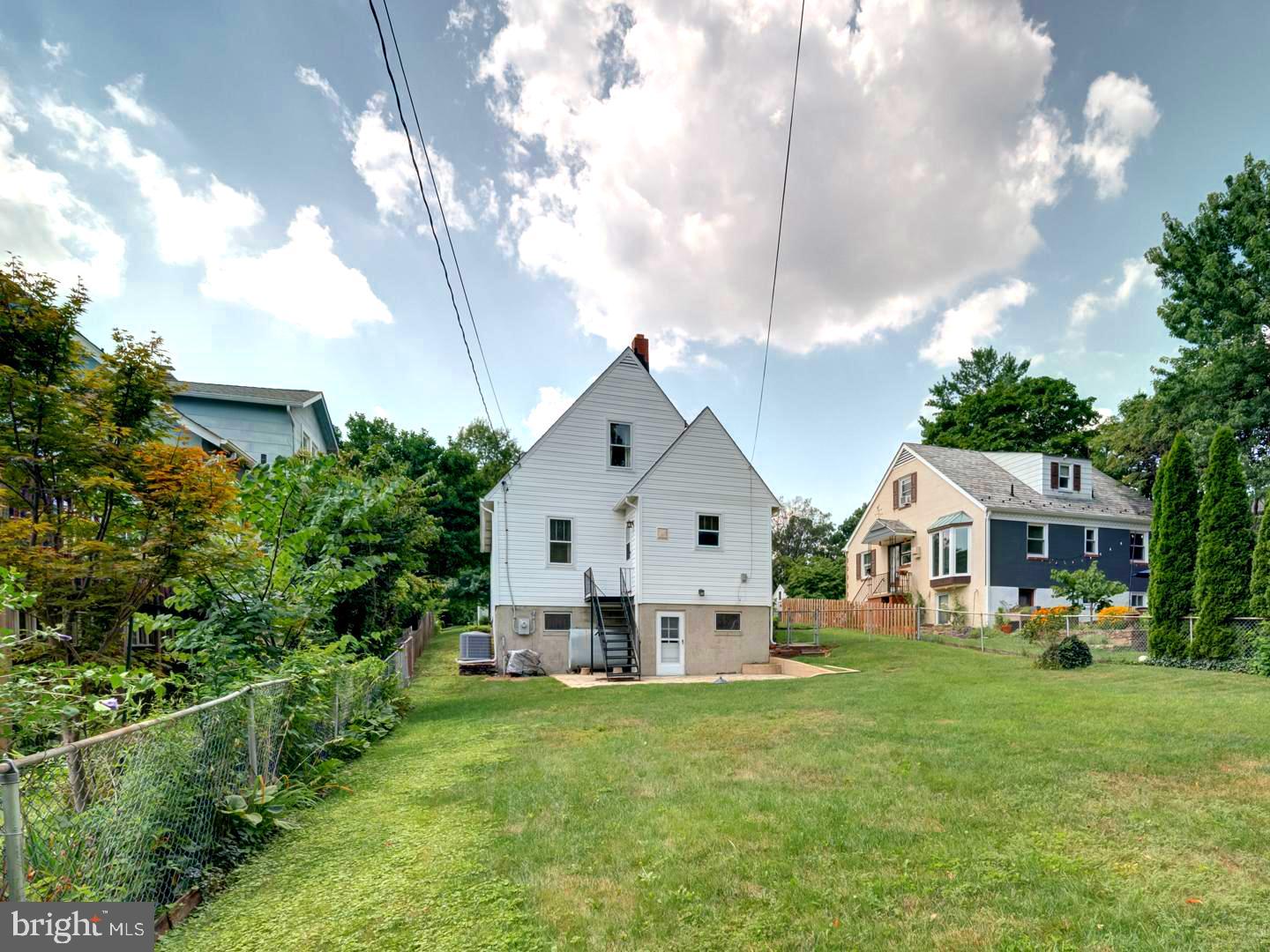 6505 Beechwood Road Baltimore, MD 21239 - Photo 43 of 46 a front view of a house with garden