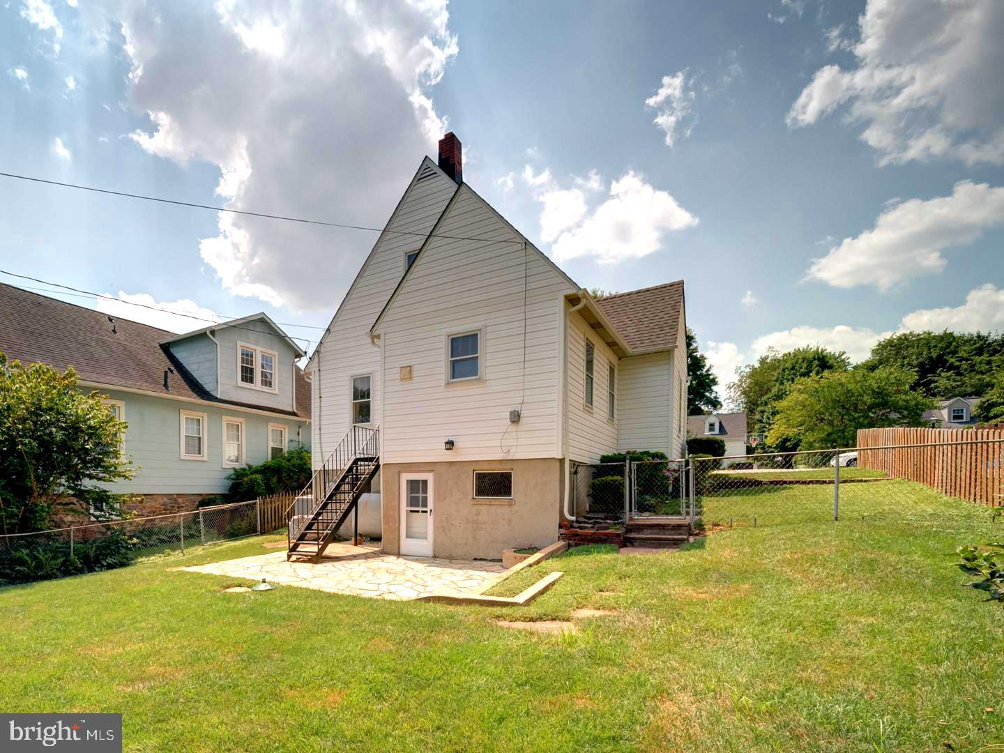 6505 Beechwood Road Baltimore, MD 21239 - Photo 45 of 46 a view of a house with swimming pool and sitting area