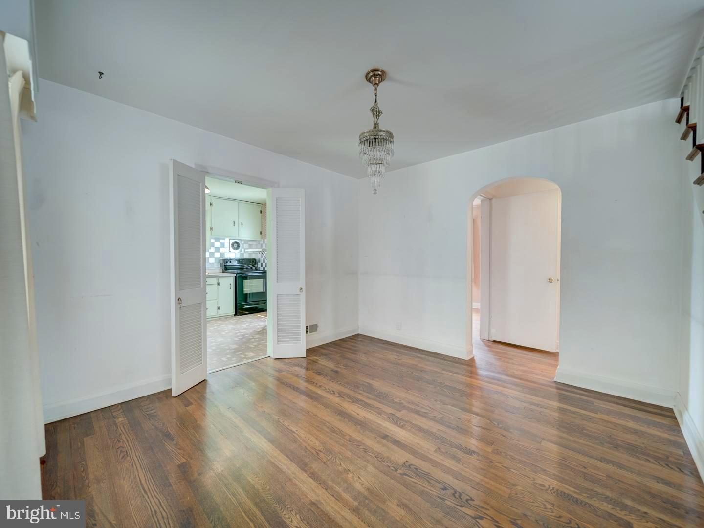 6505 Beechwood Road Baltimore, MD 21239 - Photo 9 of 46 a view of an empty room with wooden floor