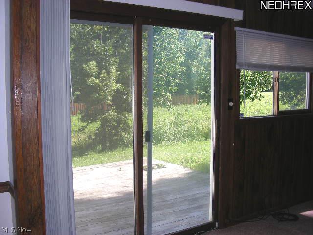 2107 South Hametown Road Akron, OH 44321 - Photo 6 of 18 Sliding glass doors from the family room provide access to the deck and backyard.