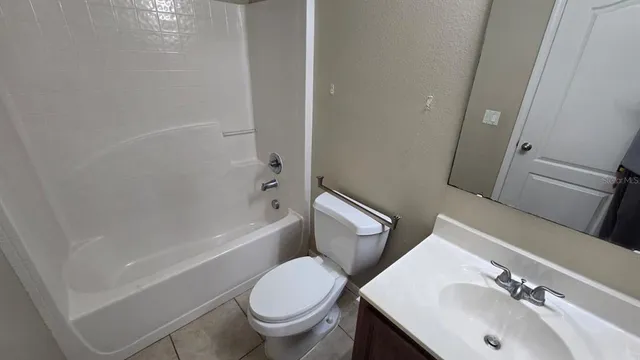 a view of an empty room with a floor to ceiling window