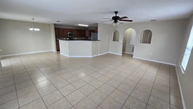 a view of a kitchen with a sink and a stove top oven