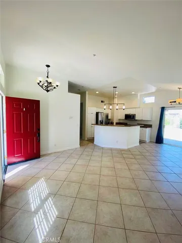 a view of a kitchen with a sink and a chandelier
