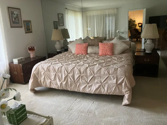 a bedroom with a bed and window