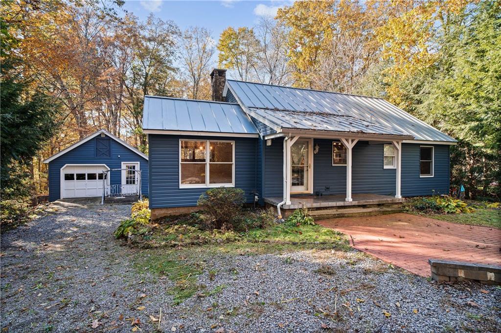 79 Willadell Road Transfer, PA 16154 - Photo 1 of 25 a front view of a house with a garden
