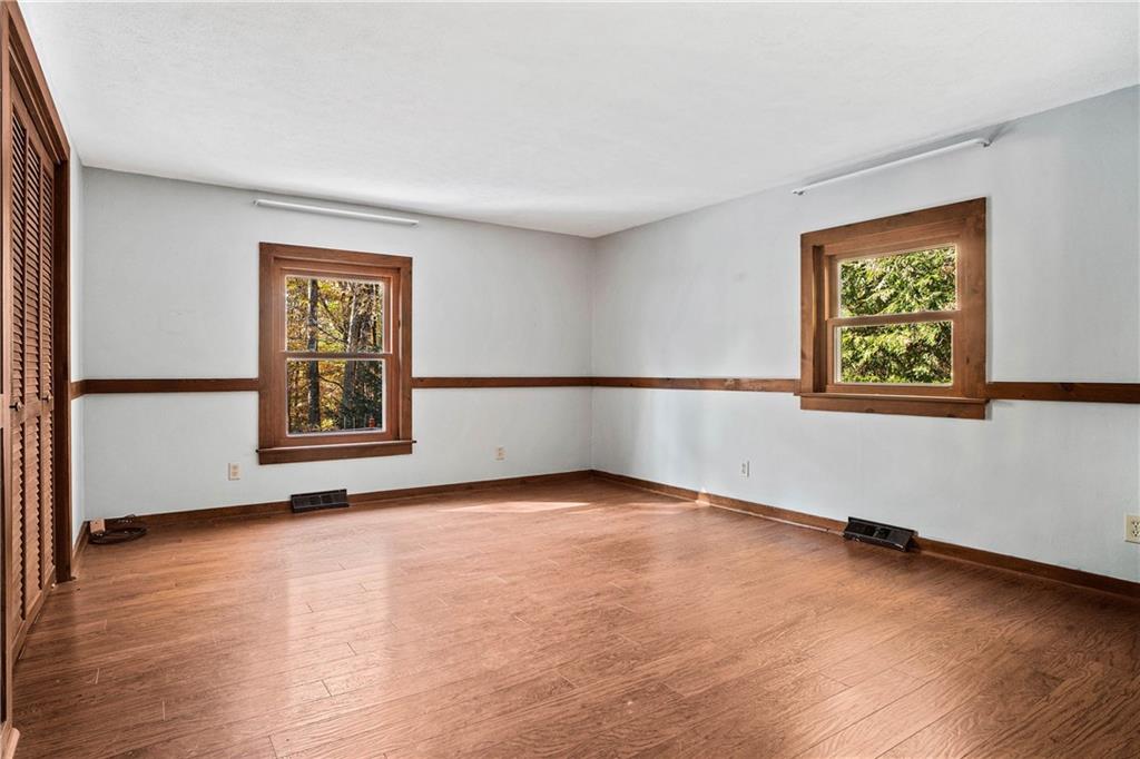79 Willadell Road Transfer, PA 16154 - Photo 16 of 25 an empty room with wooden floor and windows