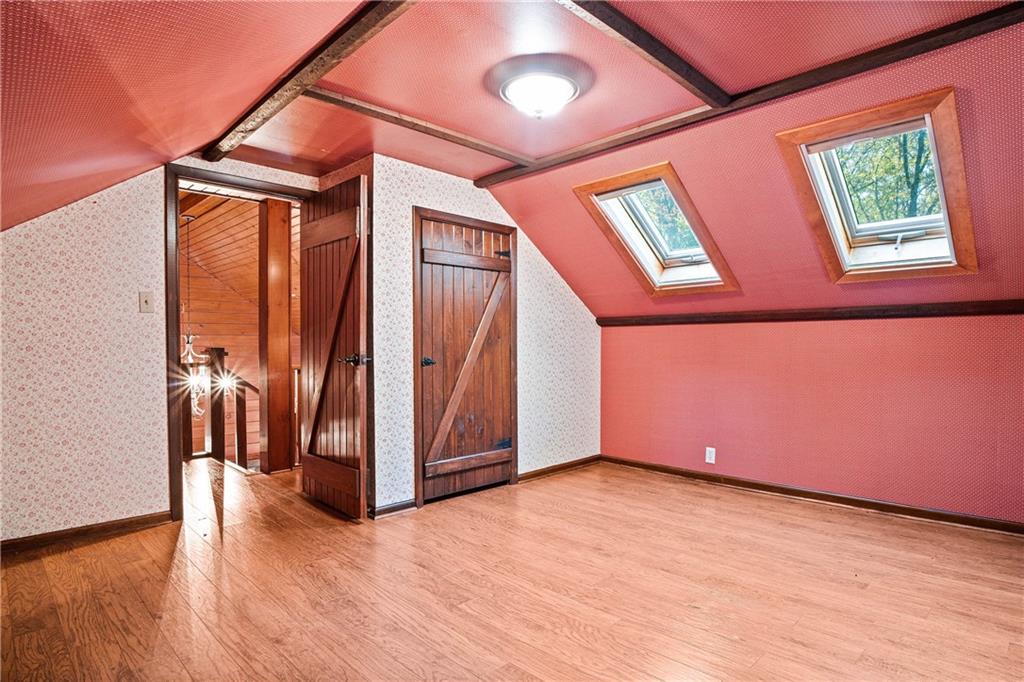 79 Willadell Road Transfer, PA 16154 - Photo 22 of 25 a view of an empty room with wooden floor and a window